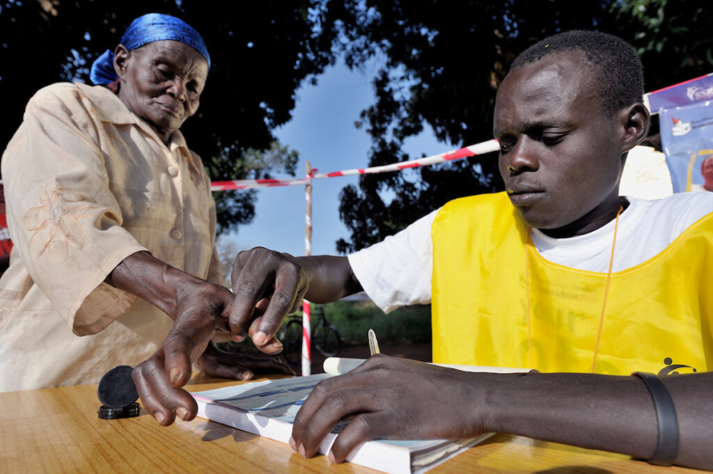 Southern Sudan woman registering to vote